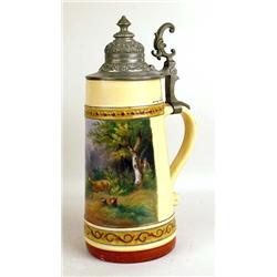 A POLYCHROME-DECORATED GLAZED CERAMIC BEER STEIN