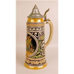 A GLAZED CERAMIC BEER STEIN
