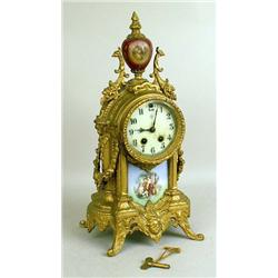 A PATINATED METAL AND PORCELAIN MANTLE CLOCK