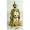 Image 1 : A PATINATED METAL AND PORCELAIN MANTLE CLOCK