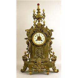 A GOTHIC PATINATED METAL MANTEL CLOCK