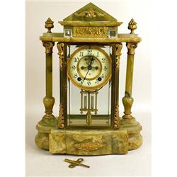 AN ORMOLU MOUNTED GREEN MARBLE MANTLE CLOCK