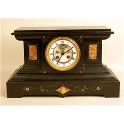 AN ONYX INLAID MANTLE CLOCK