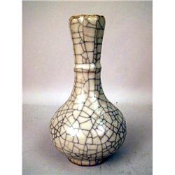 A RAKU GLAZED BALUSTER FORM VASE