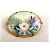Image 1 : AN OVAL HAND PAINTED BROOCH