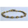 Image 1 : A 14K YELLOW GOLD WHITE GOLD DIAMOND AND YELLOW SAPPHIRE LINE BRACELET