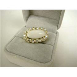 A YELLOW GOLD DIAMOND AND OPAL BROOCH