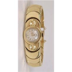 AN 18K YELLOW GOLD OMEGA LADIES WRISTWATCH