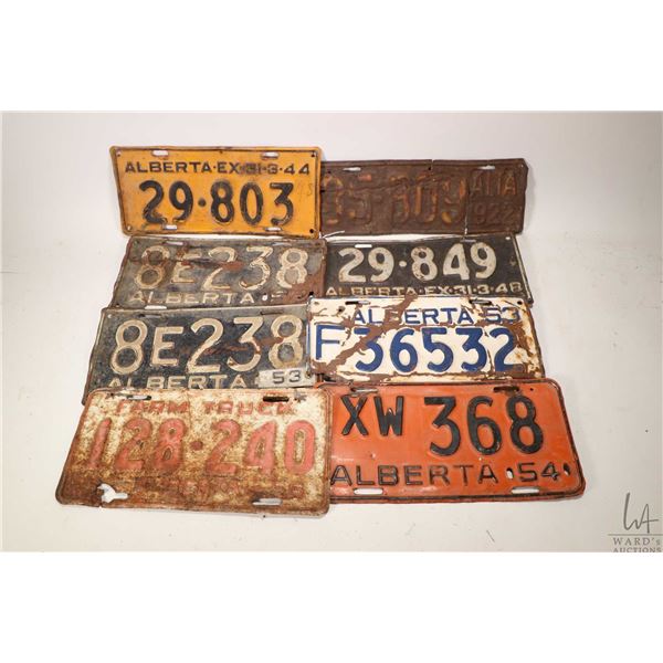 Eight vintage Alberta licence plates including 1922, 1944, 1948, 1952, two1953, 1954 and 1956