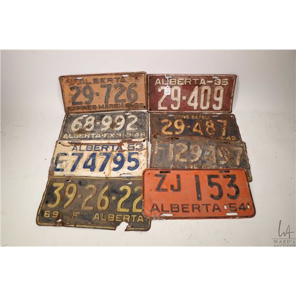 Eight Alberta licence plates including 1935, 1938, 1942, 1948, 1952, 1953, 1954 and 1969 Farm plate