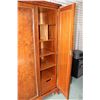 Image 2 : Antique three door wardrobe with matched grain panels, center and left door open to full length hamm