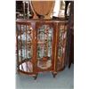 Image 1 : Curved glass English curio cabinet with original lithographed mirrored back, glass shelves and carve