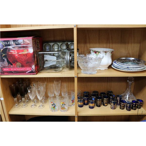 Two shelf lots of collectibles including Italian crystal stemware, Bronze Verre cobalt tumblers, lar