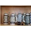 Image 1 : Shelf lot of Avon collectibles including steins, two mugs and a pipe. Note: Not available for shippi