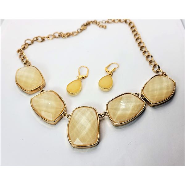 22)  GOLD TONE AND CREAMY YELLOW FACETTED