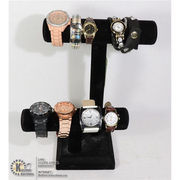 8 LADIES WATCHES ON DISPLAY STAND