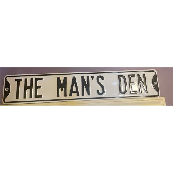 The Man's Den sign