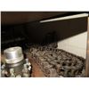 Image 11 : Contents of Shelf: Bread Oven Paddles Pan Alignment, SaniMatic Cleaner, Chains