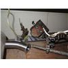 Image 14 : Contents of Shelf: Bread Oven Paddles Pan Alignment, SaniMatic Cleaner, Chains