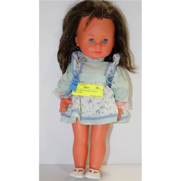 PLASTIC DOLL IN LIGHT GREEN DRESS.  #4604