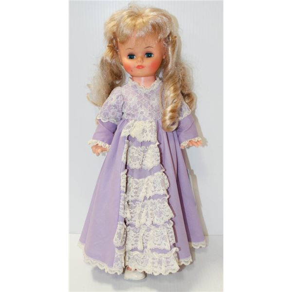 GIRL DOLL IN PURPLE DRESS.  #5815