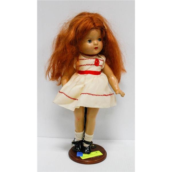 COMPOSITE RED HAIR DOLL W/ STAND.  #615
