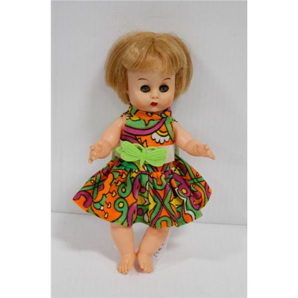 PLASTIC DOLL IN BUTTERFLY DRESS.  #4513