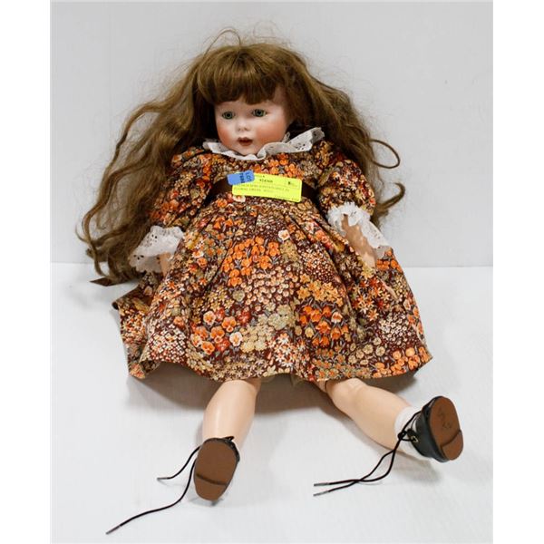 FRENCH SFBJ JOINTED DOLL IN FLORAL DRESS.  #5311
