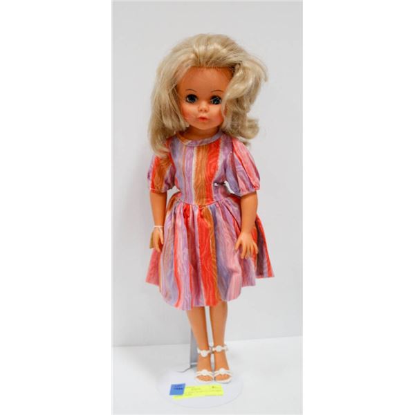 RELIABLE DOLL IN MULTI COLORED DRESS.  #3408