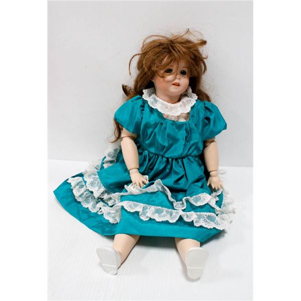 BISQUE HEAD JOINTED CONTEMPORARY DOLL IN GREEN DRESS