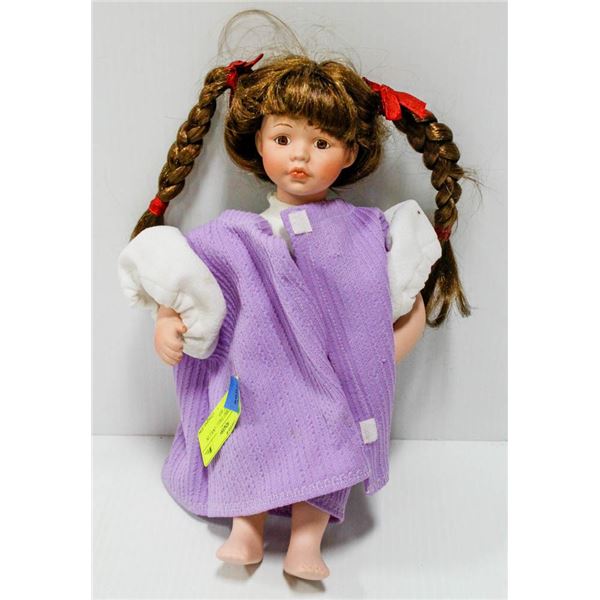 PORCELAINE "PIG TAILS" DOLL IN PURPLE DRESS.  #53
