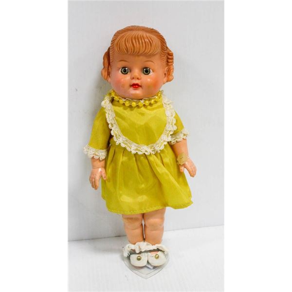 1950'S CAMPBELL'S SOUP RUBBER DOLL IN YELLOW DRESS