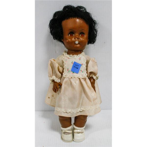 VINTAGE RELIABLE RUBBER DOLL IN IVORY DRESS