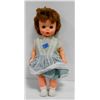 Image 1 : GIRL CHILD PLASTIC DOLL IN GREEN DRESS