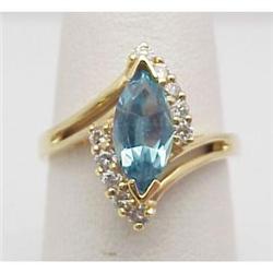 Blue topaz and diamond ring