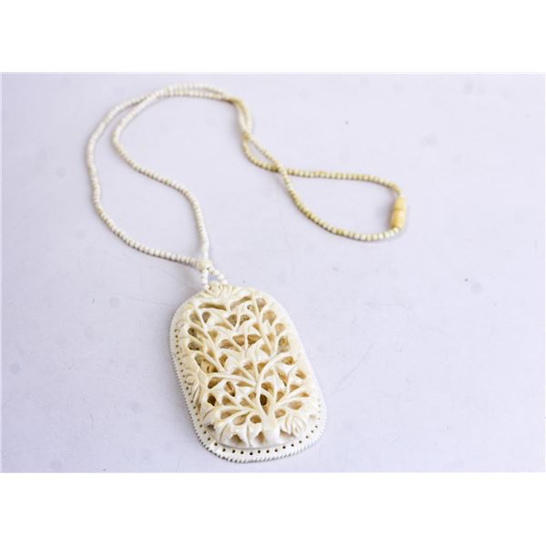 LARGE WHITE FILIGREE PENDANT ON BEADED NECKLACE