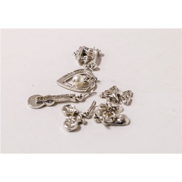 LOT OF SIX ASSORTED SILVER TONE CHARMS