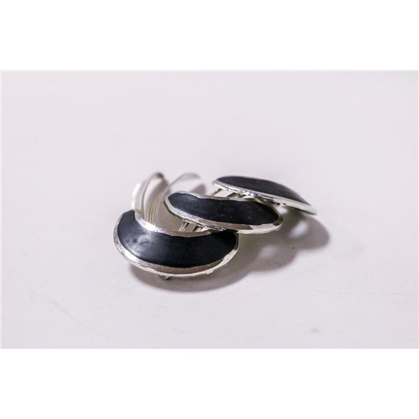 SILVER TONE AND BLACK ENAMEL FASHION BROOCH