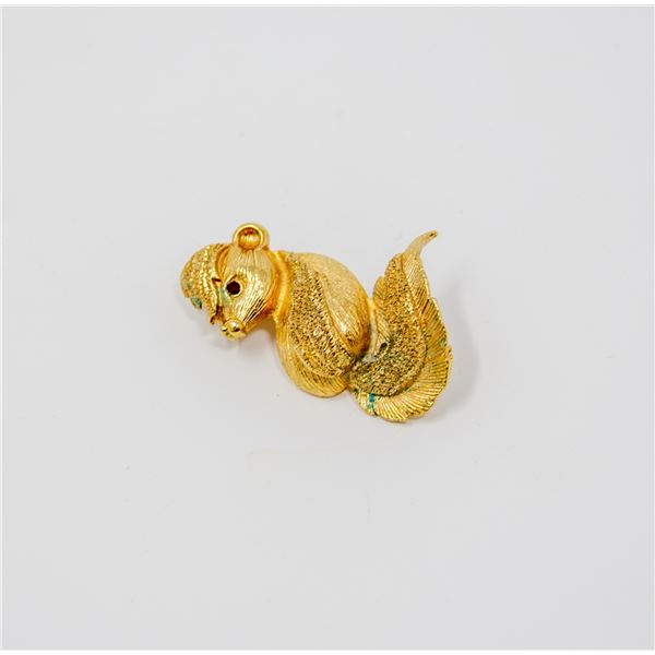 GOLD TONE SKUNK BROOCH WITH RED STONE BROOCH