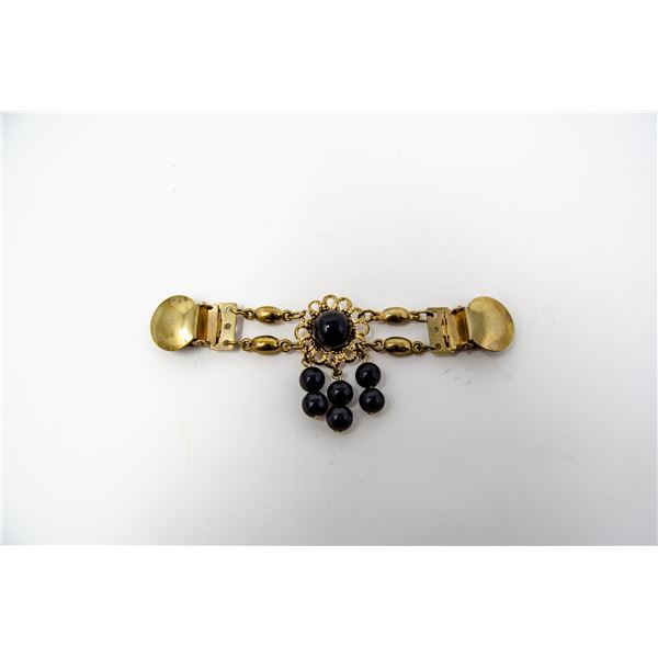 ORNATE GOLD TONE AND BLACK CAPE CLASP