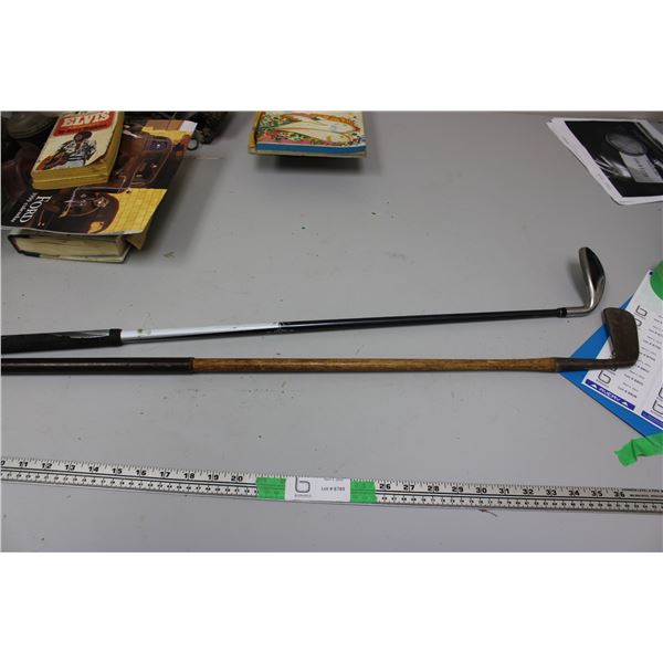 Golf Clubs - one with wooden handle