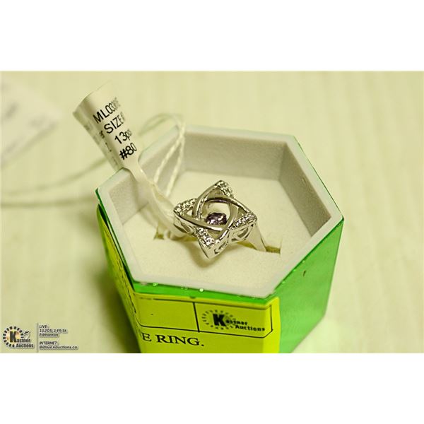NEW. DANCING STONE RING. PURPLE CZ CENTER