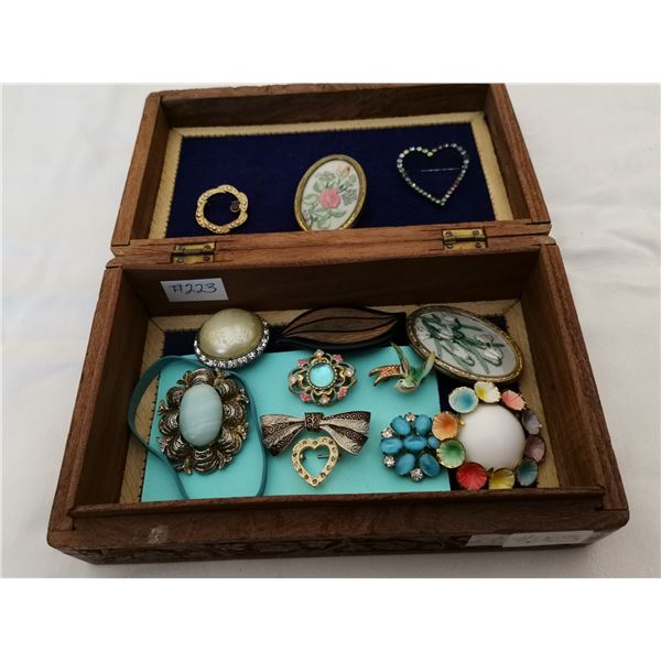 Carved box with broaches