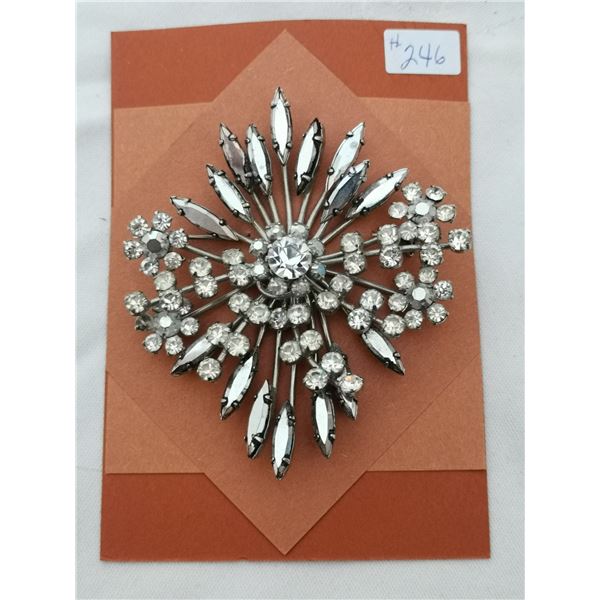 Clear and smoky rhinestone spray broach, 2 ¾” across