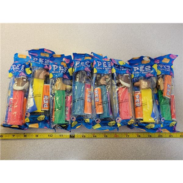 8 NOS Pez dispensers with candy (unopened)