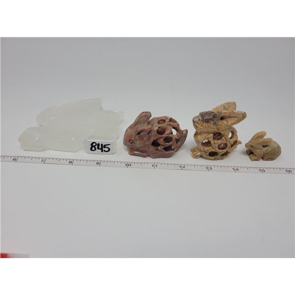 4 carved stone bunnies - 2 with babies inside