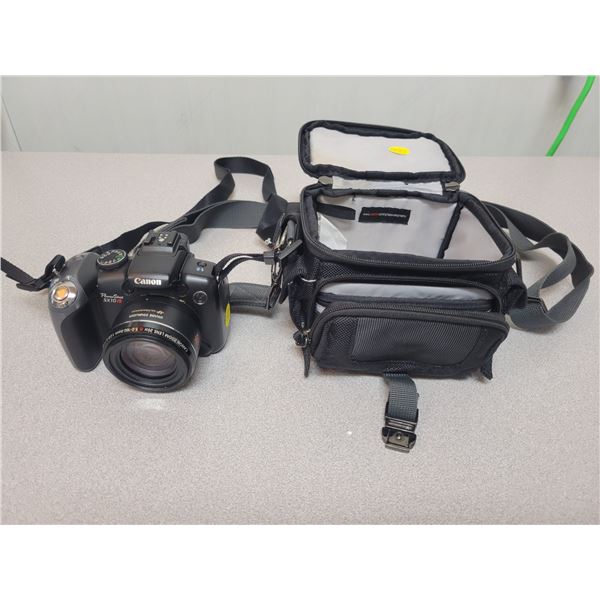 Canon Powershot SX10IS with carrying strap& case. Uses AA batteries, tested, working.
