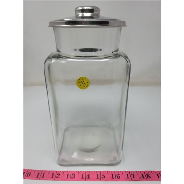 glass container with silver color top, 10.5" tall 5" W