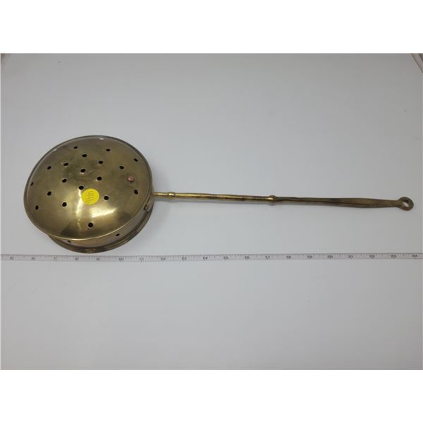 Antique brass bed warmer.