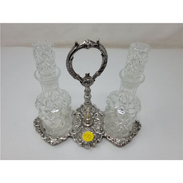 Oil & vinegar carafes in possibly silverplate caddy